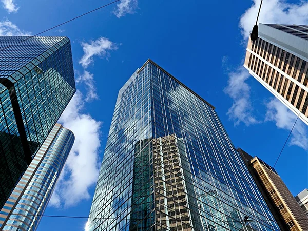 Several office buildings standing on the street
