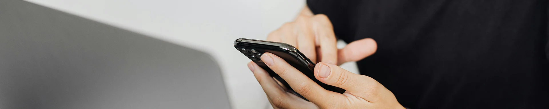 A person is pressing a phone screen.