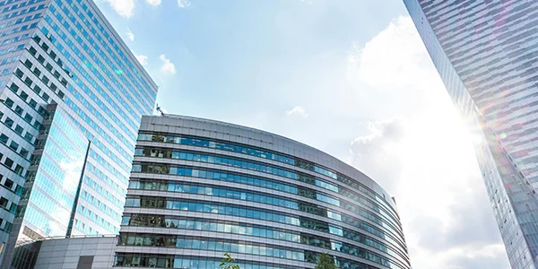 Many office buildings rise along the street.