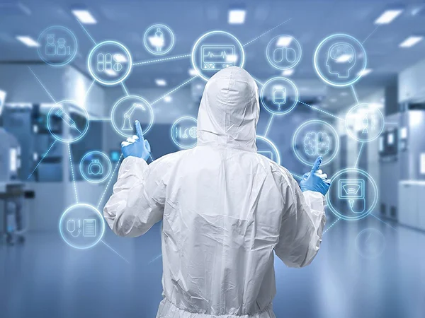 A person in protective suit is working in a cleanroom.