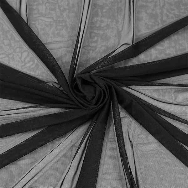 A sheet of black coarse air filter material made of nylon mesh