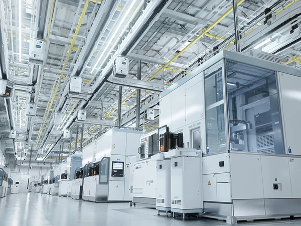 Multiple semiconductor manufacturing tools are operating within a cleanroom.